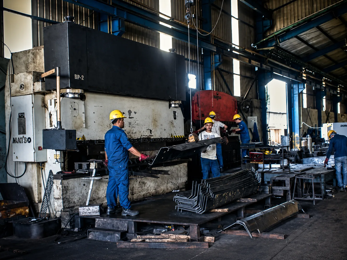 busy industrial factory with metalwork machines web 1600